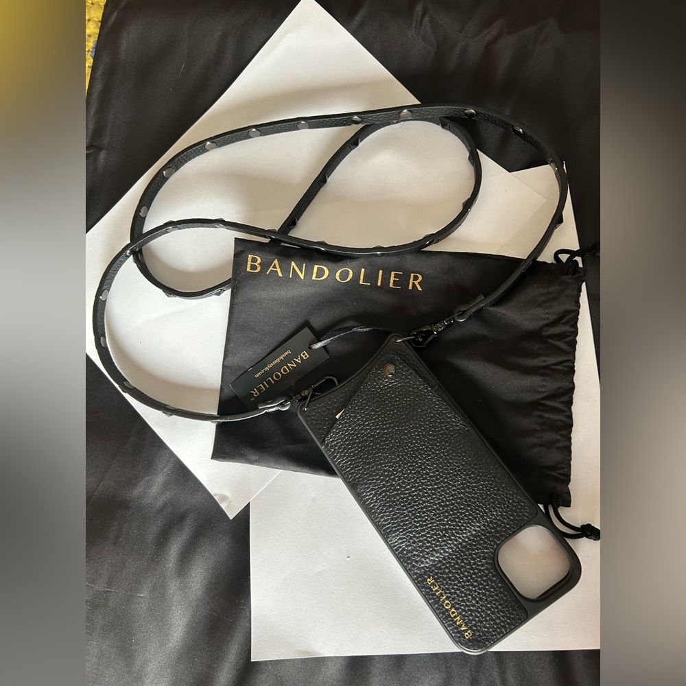 Bandolier iPhone 14 Plus black phone case w/strap and dust bag for storage.